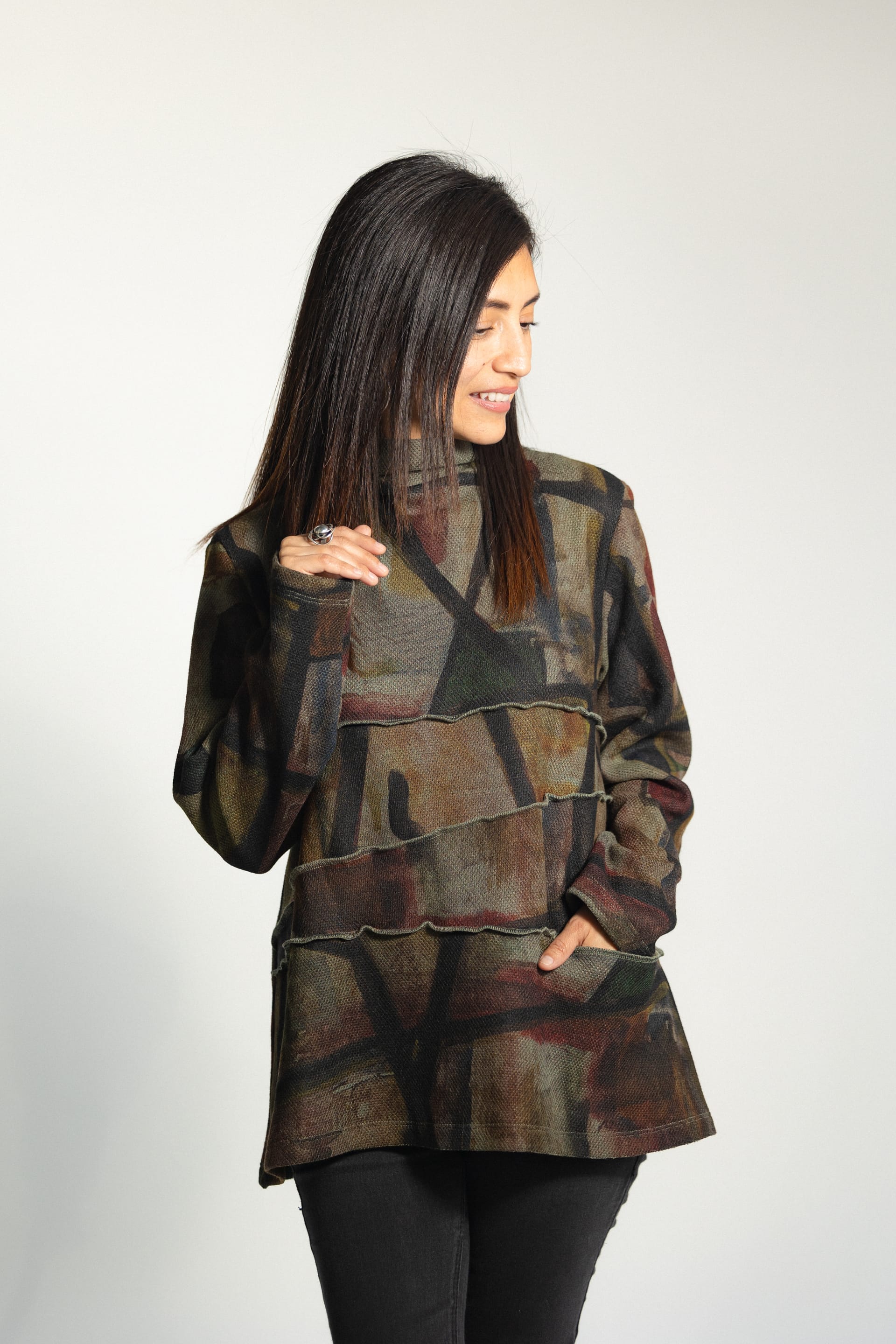 Woman in abstract print turtleneck tunic