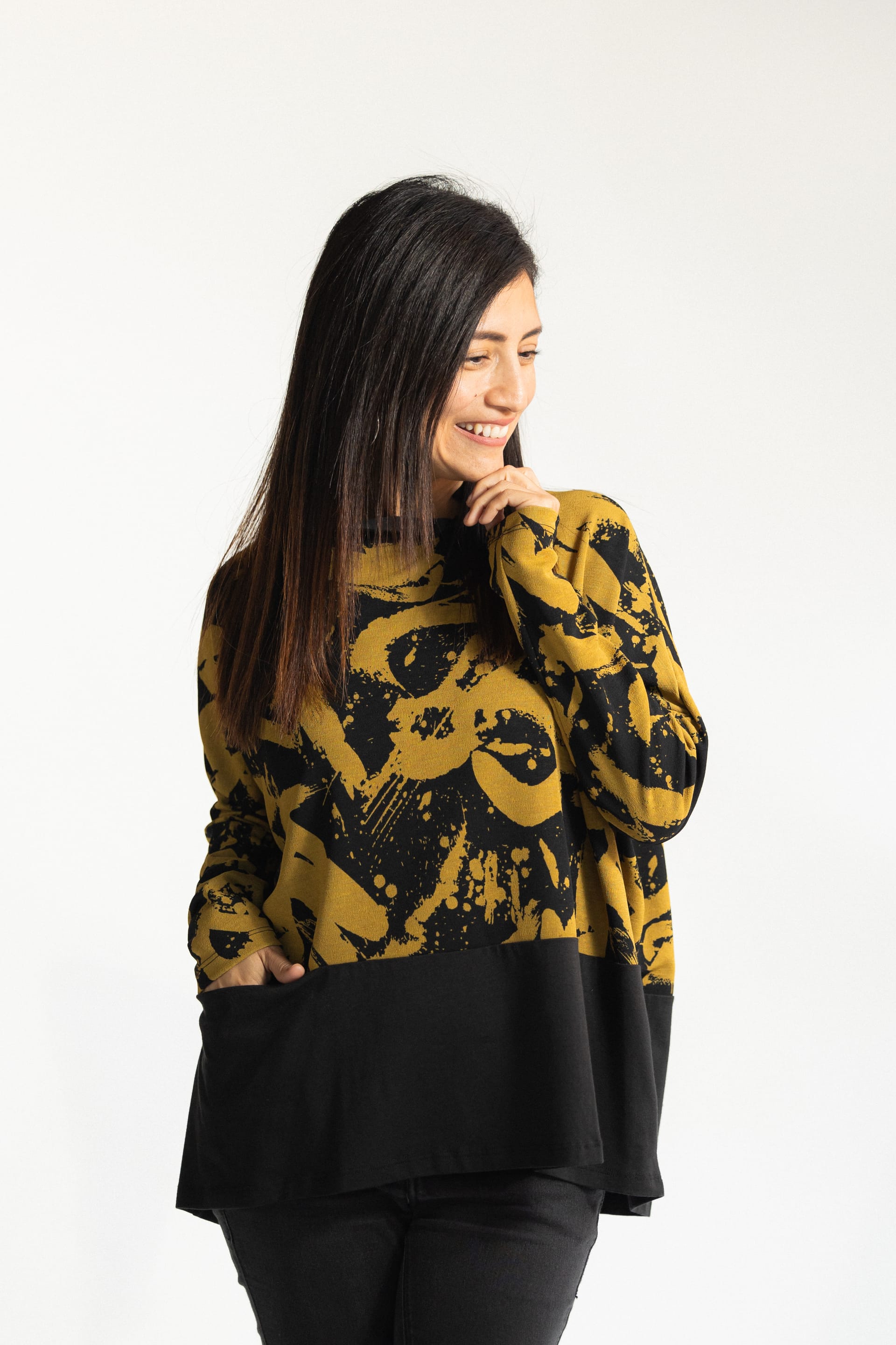 Model wearing yellow print tunic top